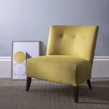 Chair in a green yellow fabric with a light neutral woven geometric design