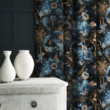 A printed velvet fabric showcasing a landscape of palms and monkeys in blue, brown and pink, as curtains