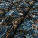 Sample of a printed velvet fabric showcasing a landscape of palms and monkeys in blue, brown and pink