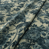Sample of a printed velvet fabric showcasing a landscape of palms and monkeys in blue and cream