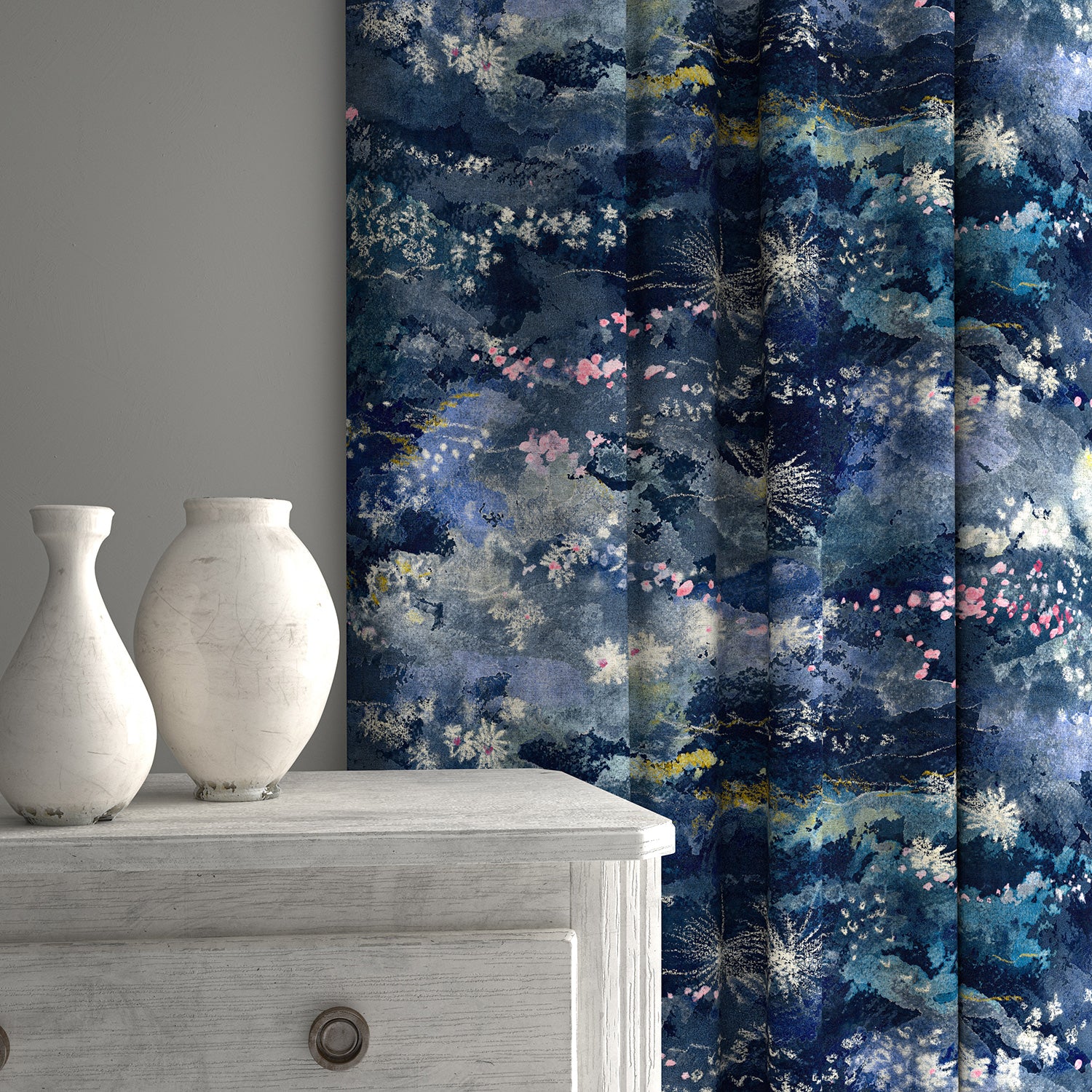 Curtains in printed velvet fabric with painterly-style skyscape design in blue colours.