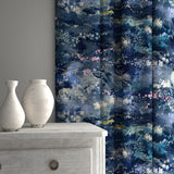 Curtains in printed velvet fabric with painterly-style skyscape design in blue colours.