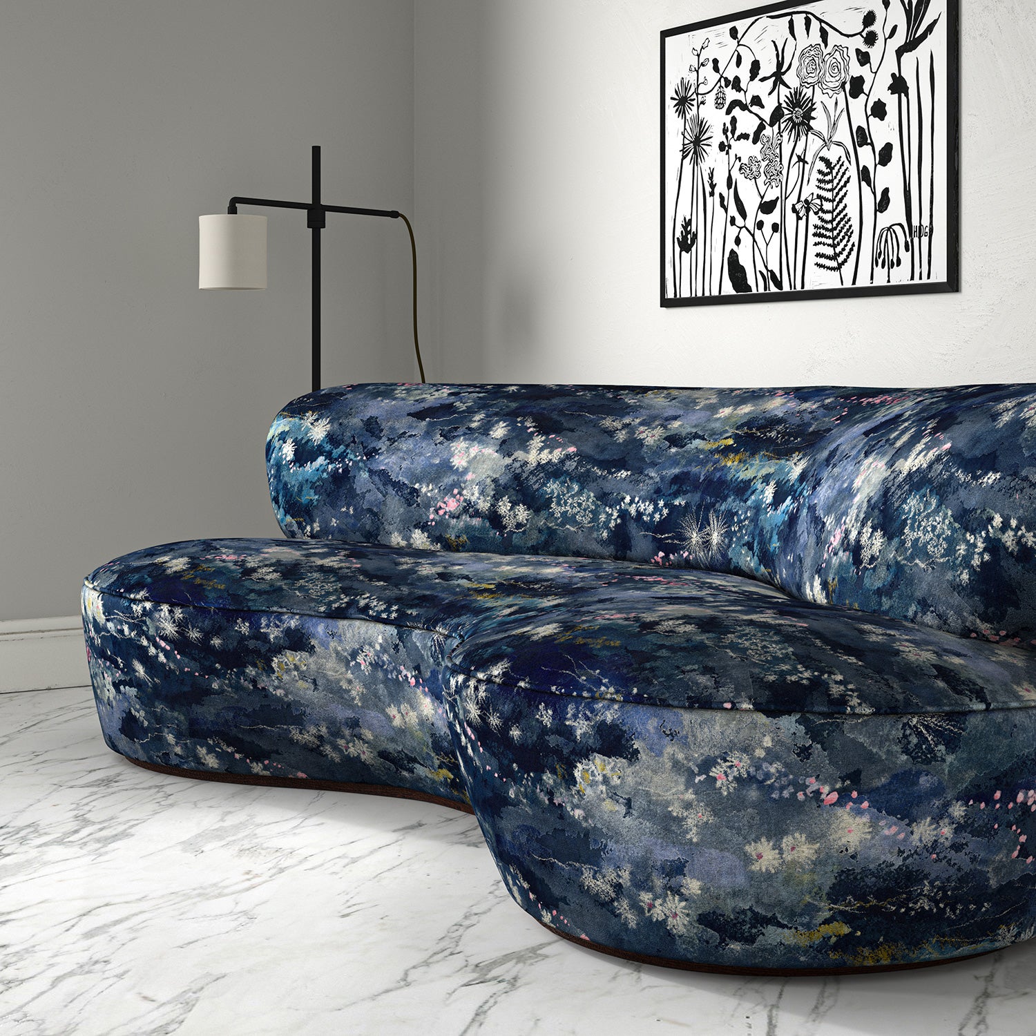 Sofa in printed velvet fabric with painterly-style skyscape design in blue colours.