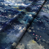 Printed velvet fabric with painterly-style skyscape design in blue colours for curtains and upholstery.