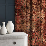 Velvet curtains in an antique carpet-style design.