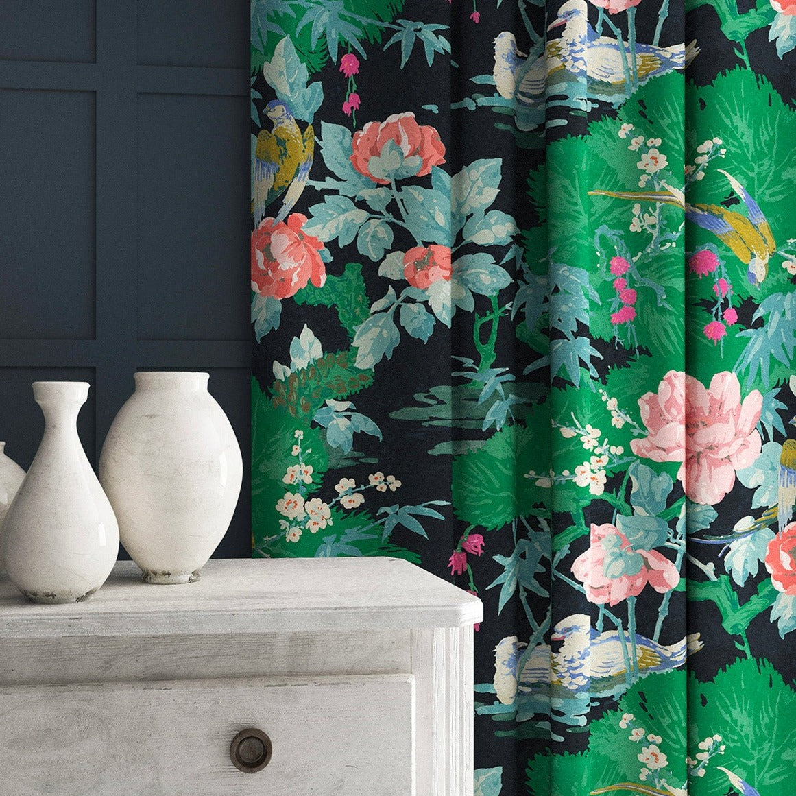 Velvet curtains in an aqua coloured floral pattern.